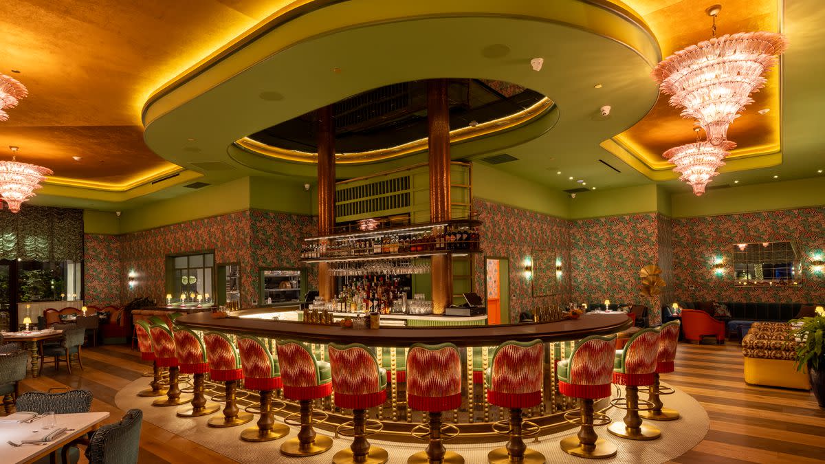 Green and gold restaurant bar and dining room